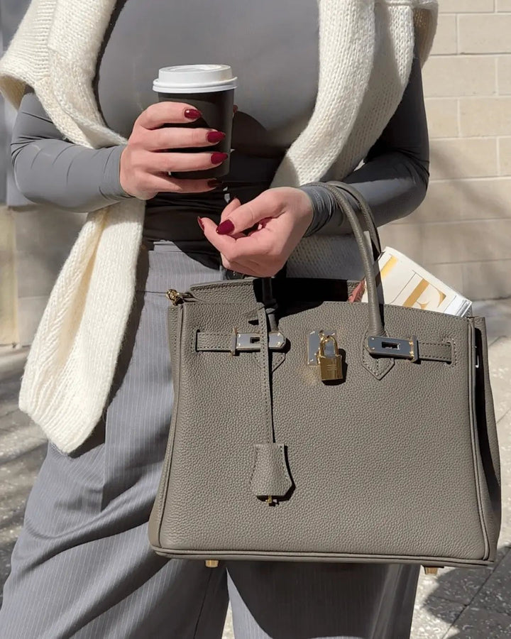 Structured genuine leather women's luxury purse, holding its elegant shape beautifully.