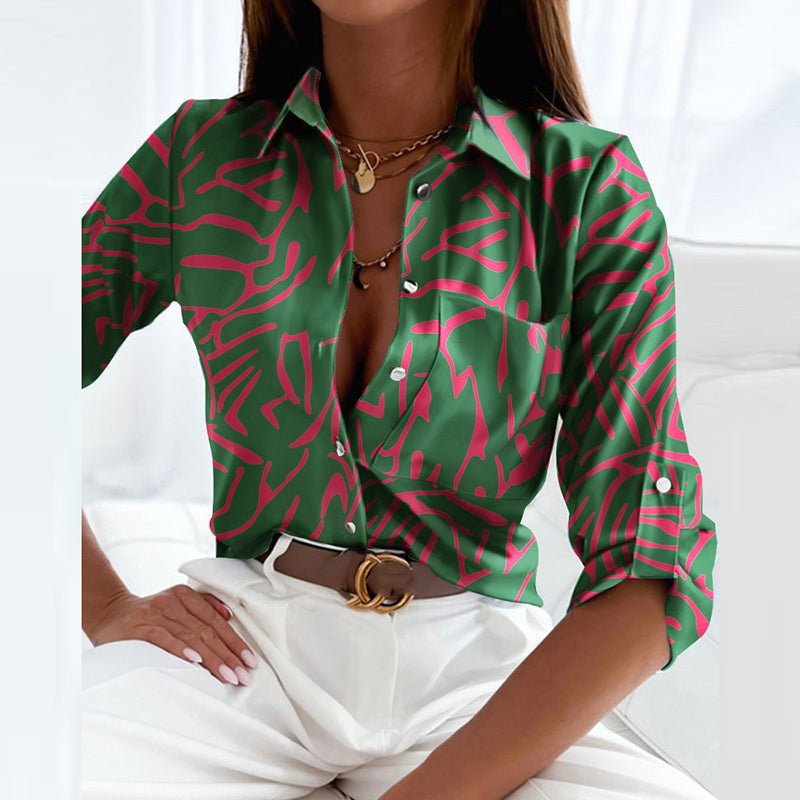 Chic women's long-sleeve collared top with an eye-catching geometric pattern for professional wear.