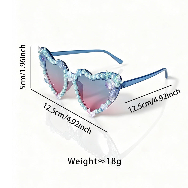 Fashionable women's cat-eye party sunglasses with decorative frames and gradient lenses.