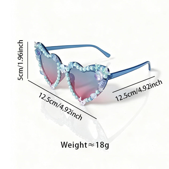Fashionable women's cat-eye party sunglasses with decorative frames and gradient lenses.