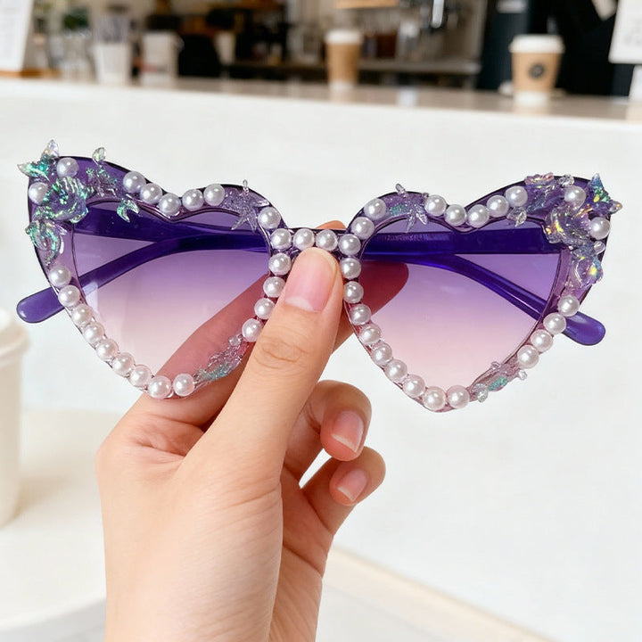 Glamorous women's cat-eye sunglasses, embellished design, gradient lenses, and UV protection.