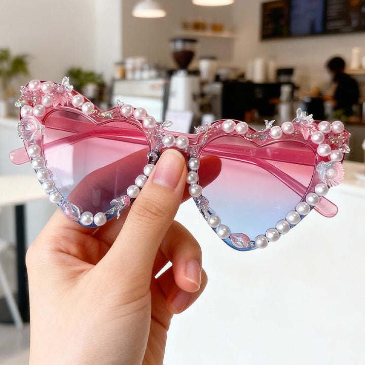 Stylish women's cat-eye sunglasses with UV protection and glamorous, embellished frames.