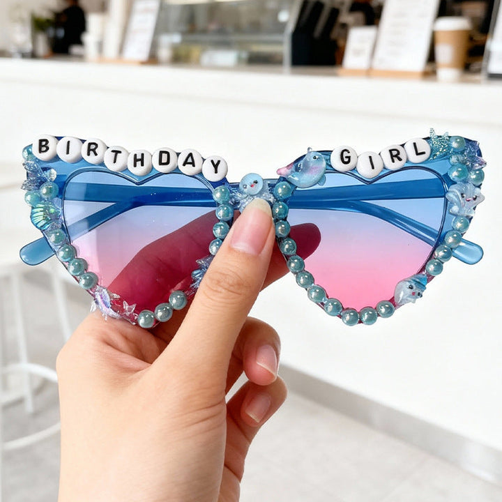 Women's glamorous cat-eye sunglasses with gradient lenses, embellished details, and UV protection.