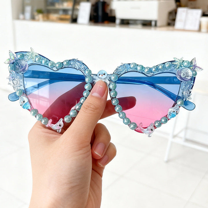 Fashionable women's cat-eye sunglasses, a glamorous accessory with UV protection for any party.