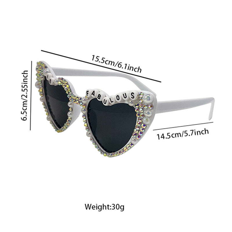 Pearl-accented heart sunglasses for women, a glamorous party fashion accessory.