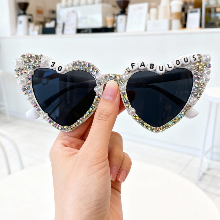 Statement rhinestone heart sunglasses for women, a stylish and glamorous accessory.