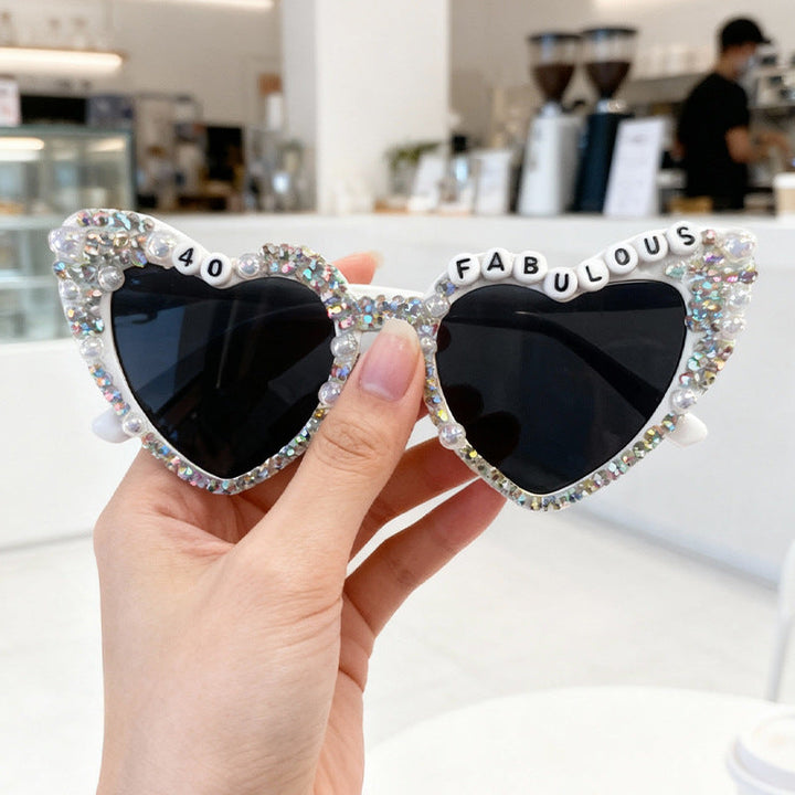 Women's glamorous heart sunglasses featuring elegant pearls & shimmering rhinestones.