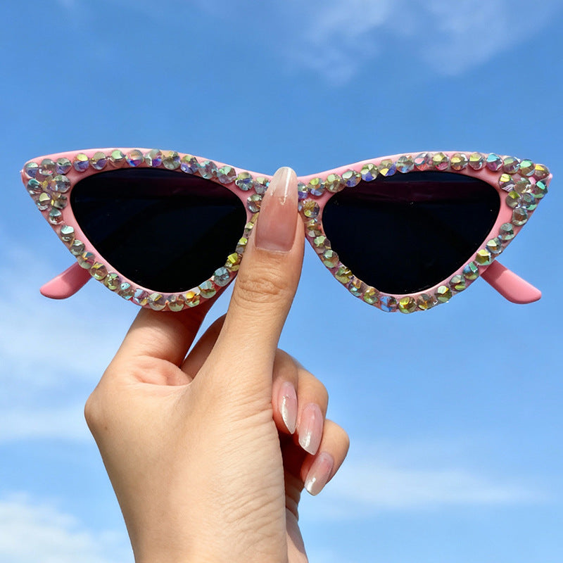 Women's glamorous rhinestone cat-eye sunglasses, a chic fashion accessory.