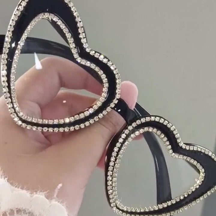 Women's glamorous rhinestone heart sunglasses, offering stylish UV protection.