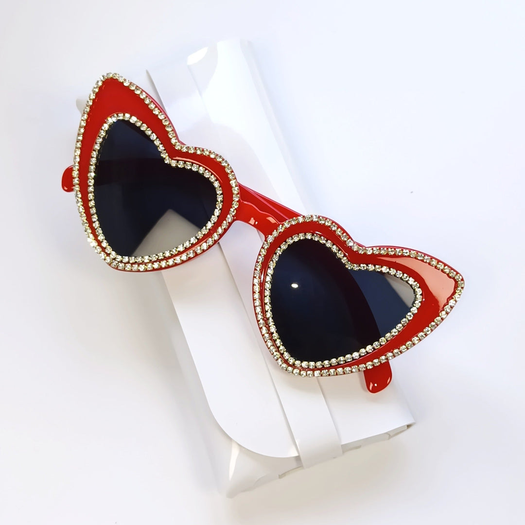 Eye-catching women's heart sunglasses, rhinestones provide glamorous sparkle & UV defense.