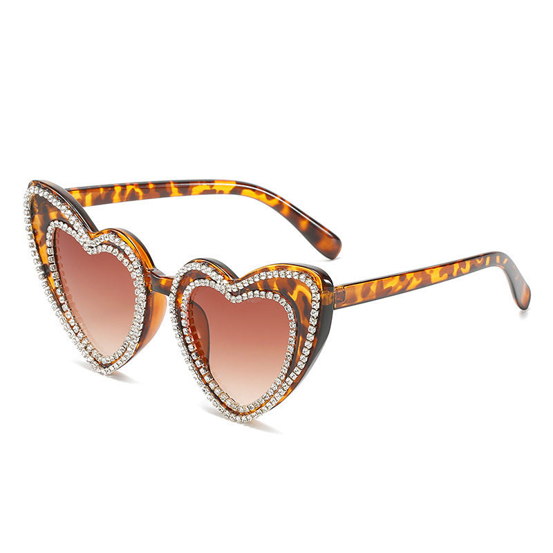 Fashionable heart sunglasses for women, with sparkling rhinestones & essential UV protection.