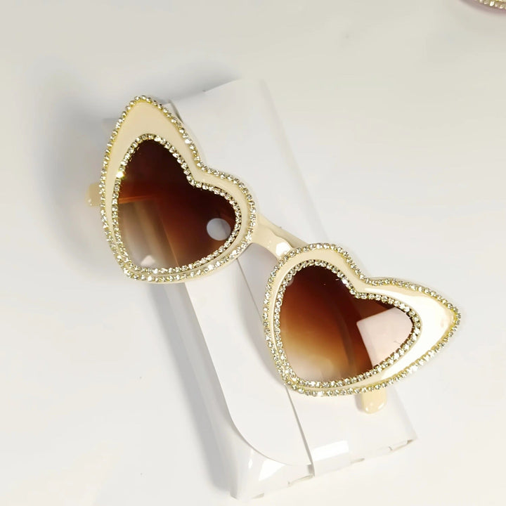 Women's glamorous heart sunglasses, featuring sparkling rhinestones & full UV protection.