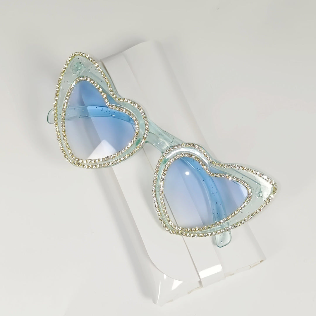 Trendy heart sunglasses for women, adorned with rhinestones, stylish UV protection.