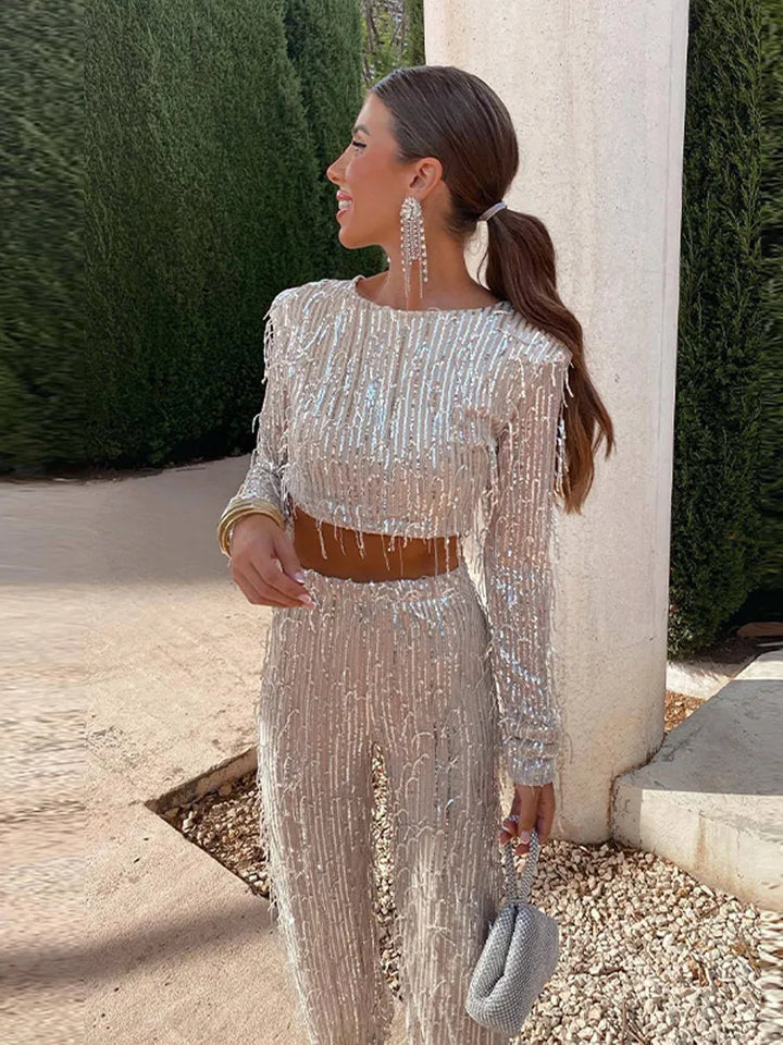 Women's glamorous sequin two-piece set with dazzling top & high-waist trousers. Perfect for evening wear.