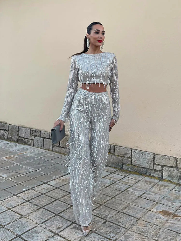 Women's special occasion sequin set: festive top & high-waist trousers. A glamorous party ensemble.