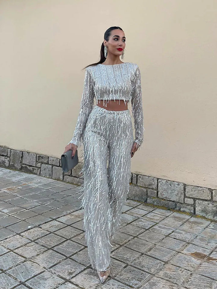 Women's special occasion sequin set: festive top & high-waist trousers. A glamorous party ensemble.