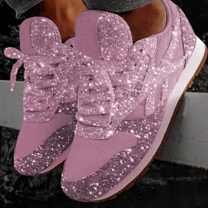 Chunky platform women's sneakers with glitter finish. Trendy lace-up style for fashion-forward streetwear and casual comfort.