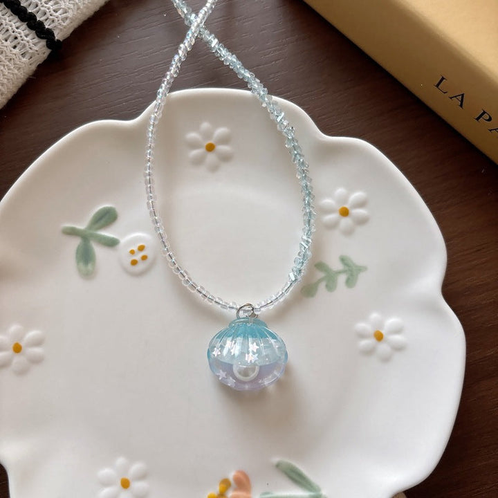 Women's sparkling fish tail necklace, a chic ocean-inspired pendant.
