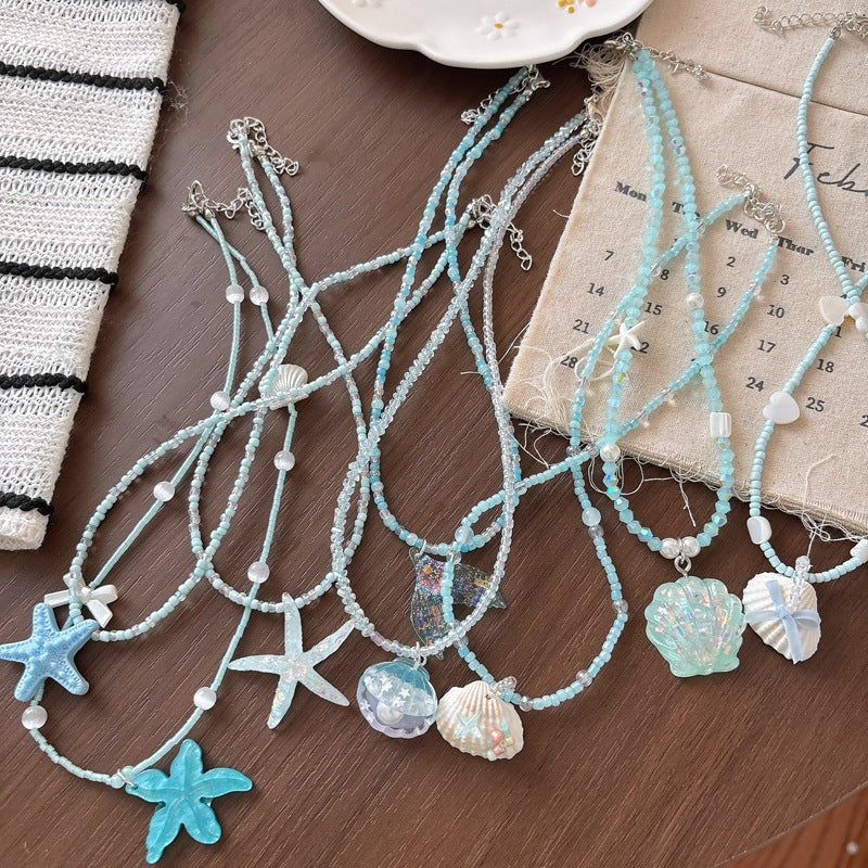 Elegant glitter fish tail necklace, a chic ocean-inspired fashion accessory for women.