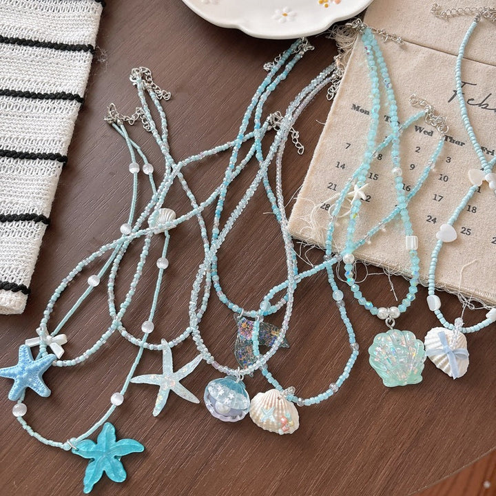 Elegant glitter fish tail necklace, a chic ocean-inspired fashion accessory for women.
