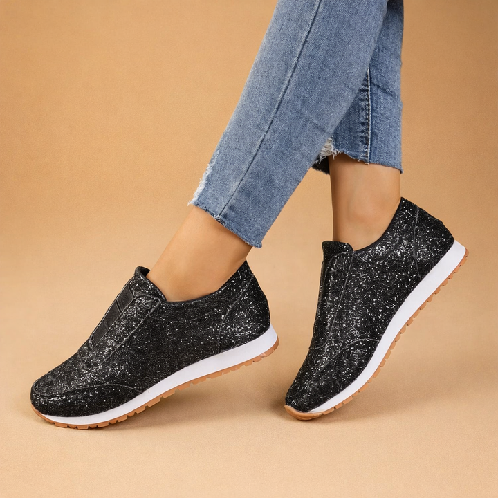 Women's glitter slip-on sneakers offering stylish comfort for everyday wear. Sparkly casual fashion footwear.