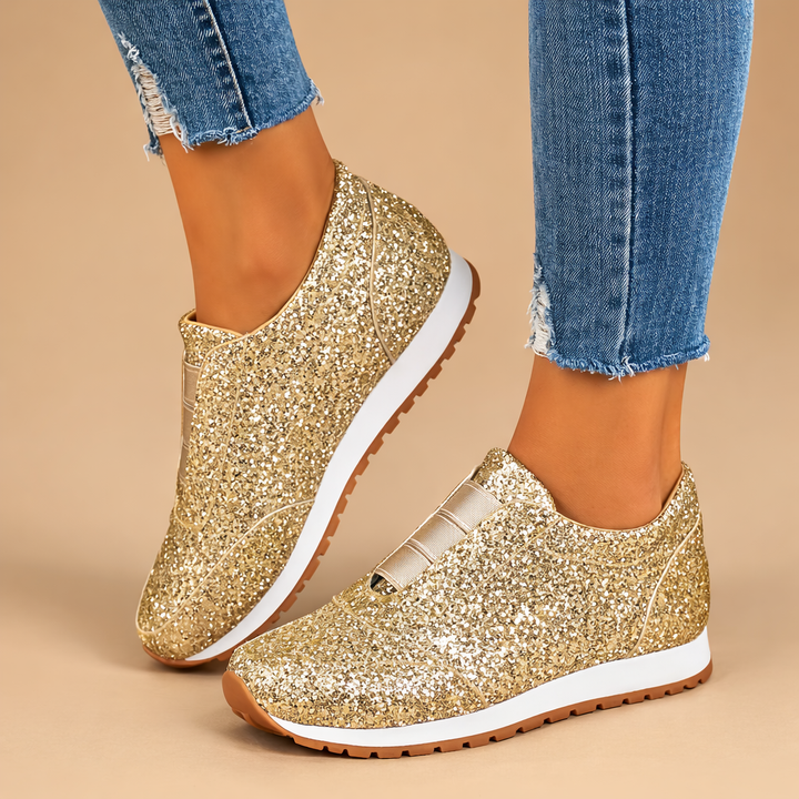 Comfortable women's glitter slip-on sneakers, perfect for stylish casual wear. Easy everyday fashion footwear.
