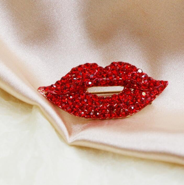Women's glittering red lip brooch pin, a stylish fashion accessory perfect for adding sparkle.