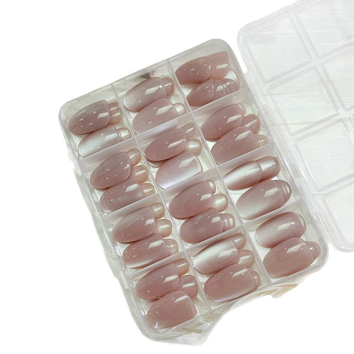 Close-up of glossy press-on nail tips, offering a professional, quick & easy false nail solution.