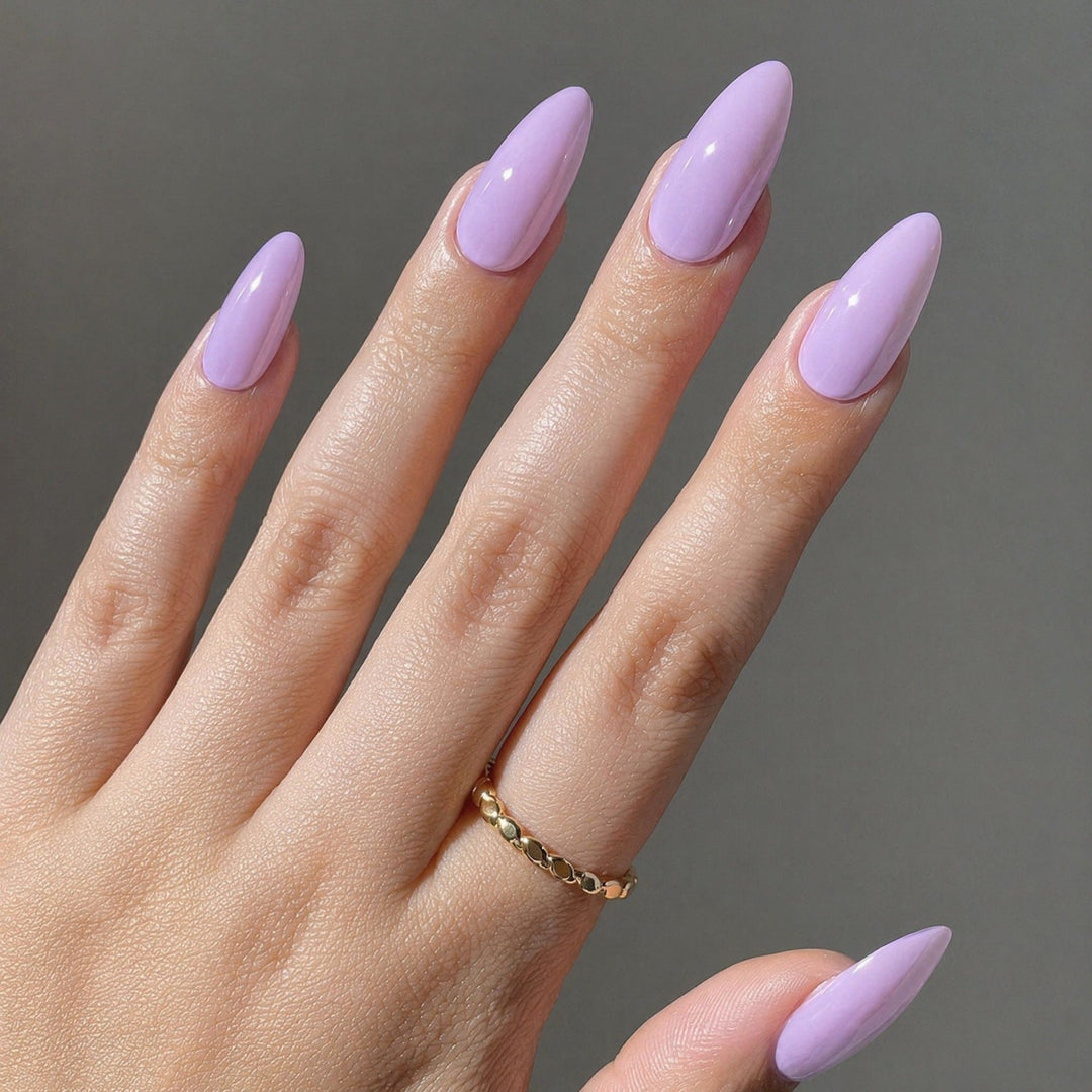 Women's glossy sharp pointed false nail tips, perfect for an elegant manicure.