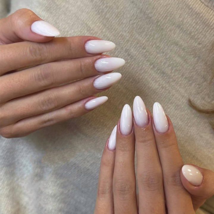 Women's elegant glossy sharp pointed nail tips, perfect for dramatic nail art and sophisticated style.