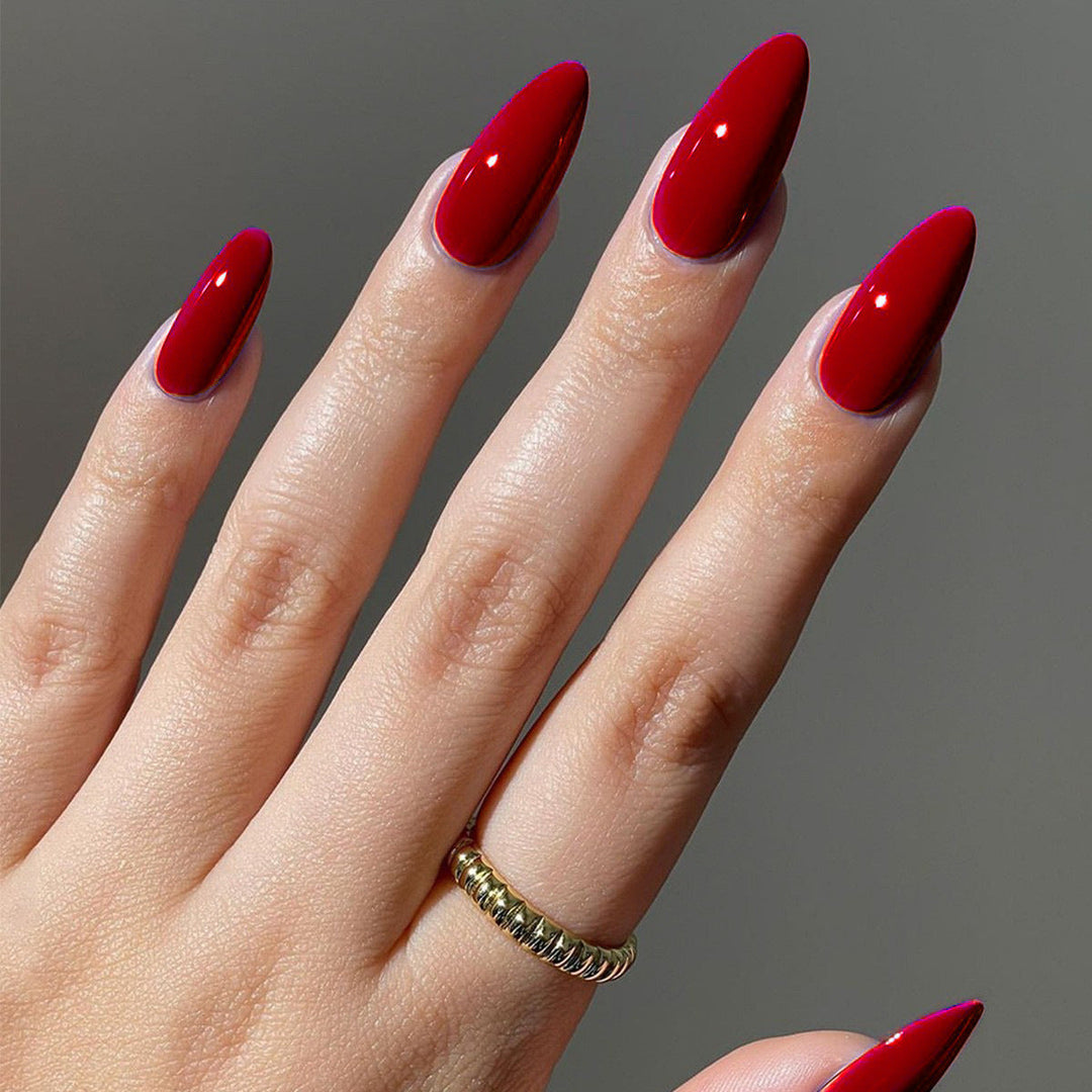Easy-to-apply glossy sharp pointed press-on nails, offering a professional and elegant at-home manicure.