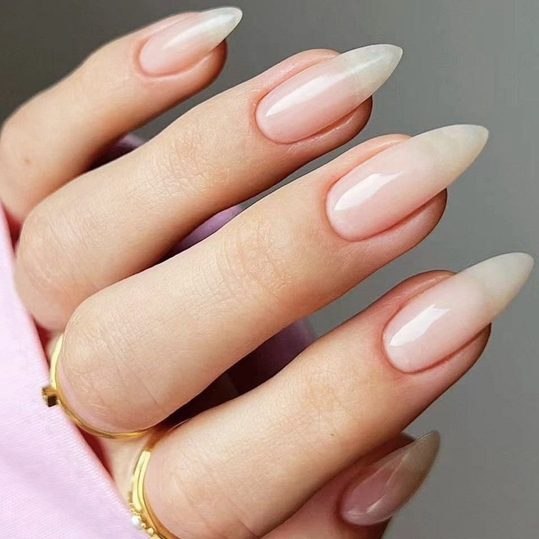 Elegant glossy sharp pointed press-on nails for women, creating a chic and modern look.