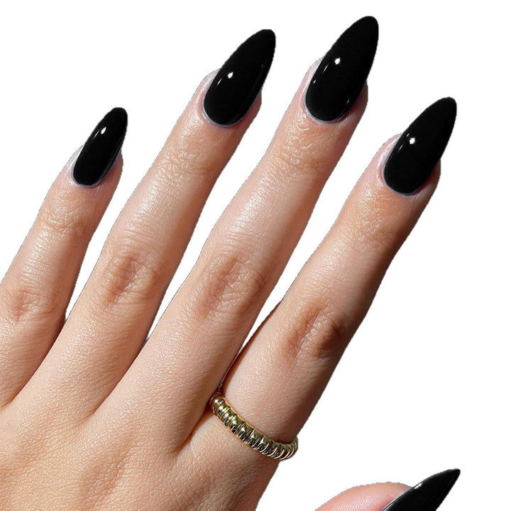 Long sharp pointed false nails with a high-gloss finish, ideal for a striking women's manicure.