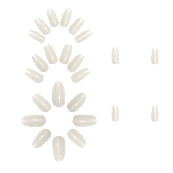 Close-up of glossy white gel nail extensions, showcasing smooth, durable finish for chic, long-lasting manicures.