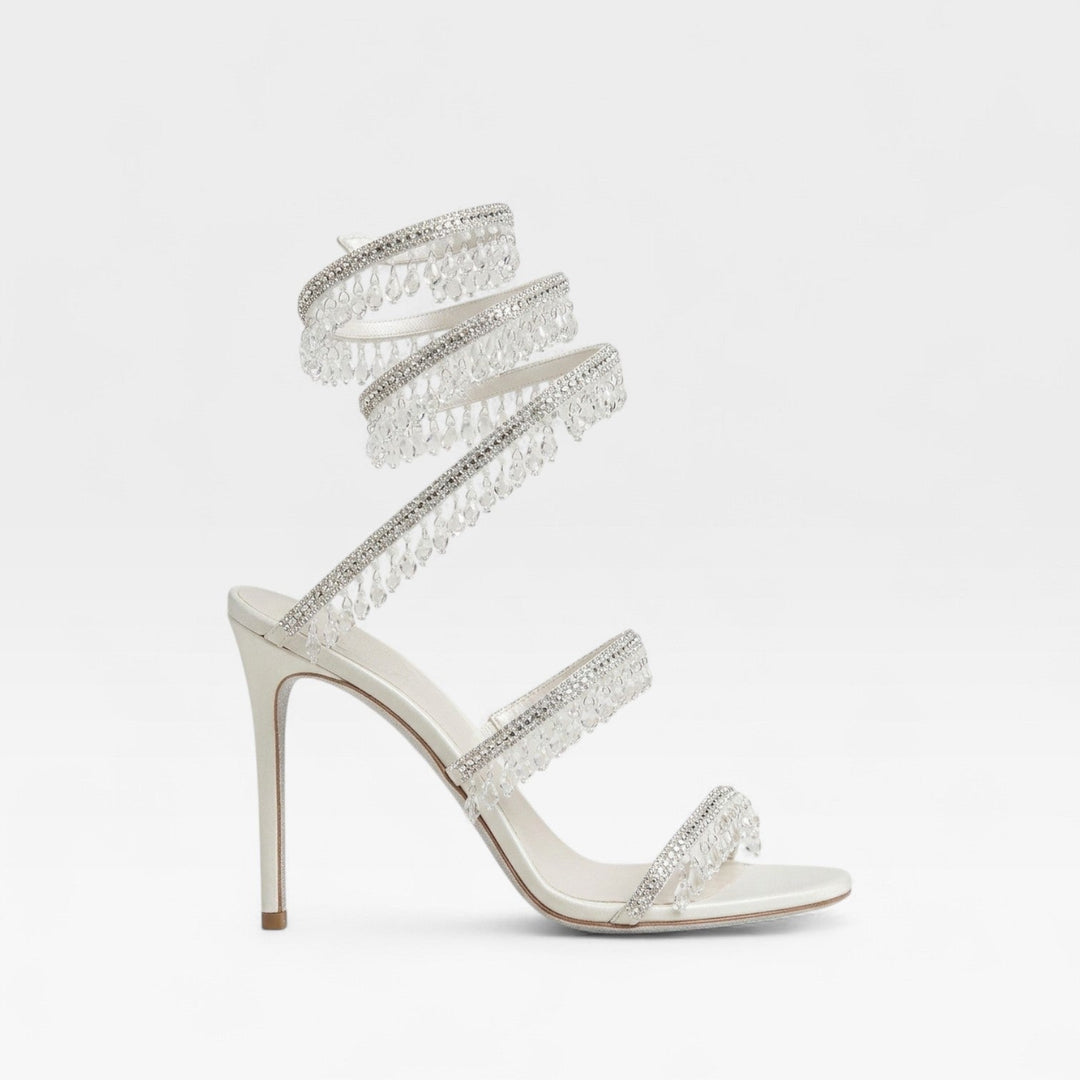 Dazzling gold women's footwear: block heel sandals adorned with brilliant crystals.