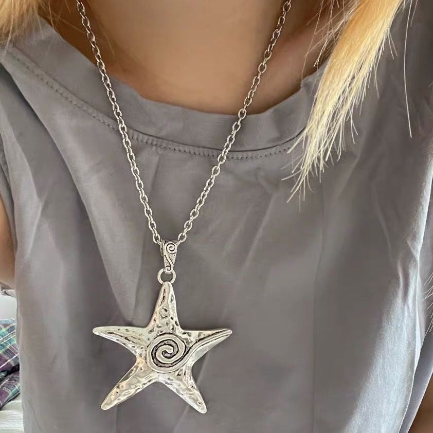 Women's gold celestial star pendant necklace, elegant adjustable fashion jewelry, perfect gift.