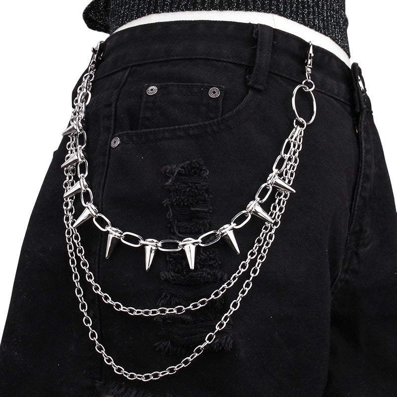 Adjustable silver chain belt with edgy stud accents, creating a bold urban statement piece for women.