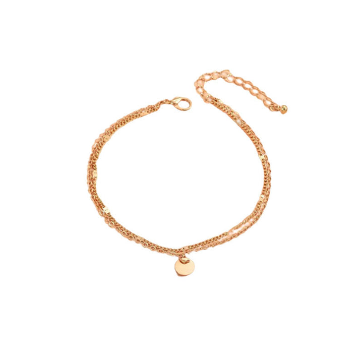 Elegant gold layered charm anklet for women, an adjustable and delicate piece for summer fashion.