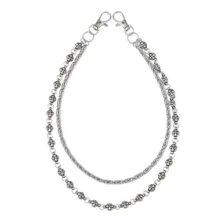 Fashionable women's chain belt with decorative pendants. Elegant gold-tone waist accessory for any outfit.