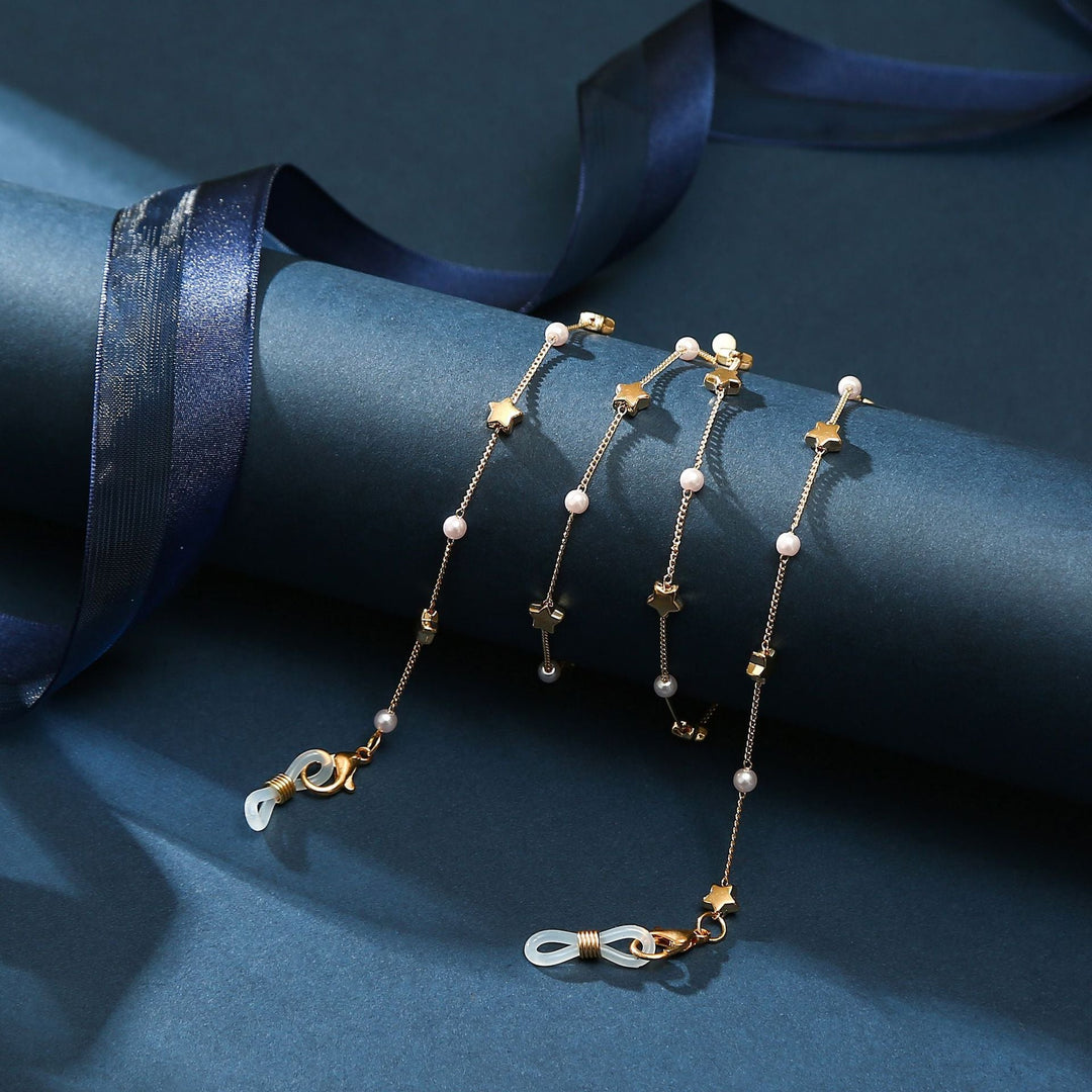 Delicate layered anklet for women, featuring a heart charm and tiny pearl accents.
