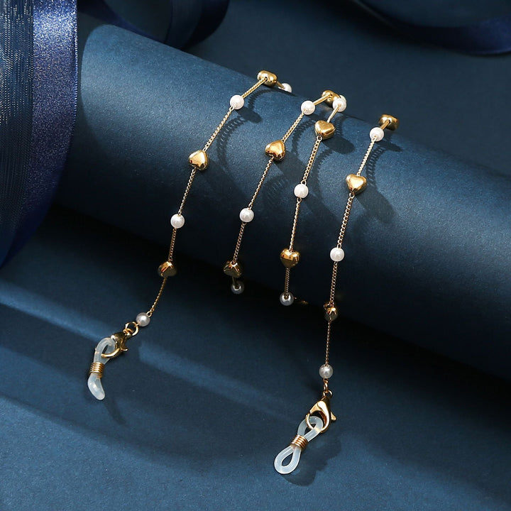 Feminine gold layered anklet with a cute heart charm, elegant and comfortable for daily wear.