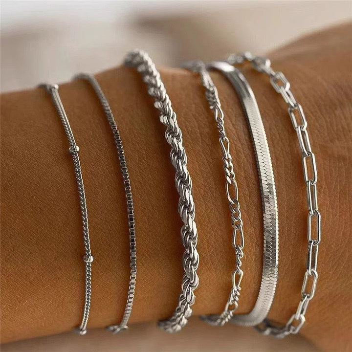 Elegant silver-tone textured chain bracelet set for women, adjustable & stackable fashion accessory.