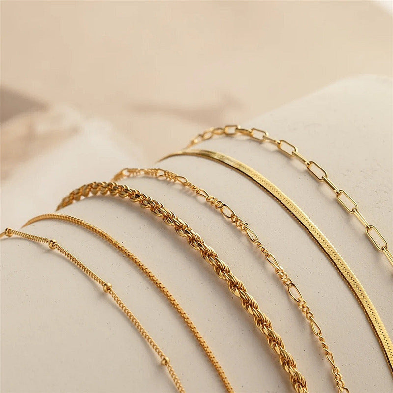 Adjustable women's textured chain bracelet set, ideal for stacking; gold & silver tone options available.