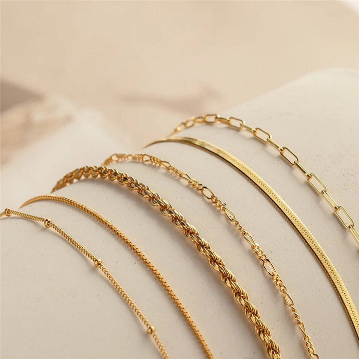Adjustable women's textured chain bracelet set, ideal for stacking; gold & silver tone options available.