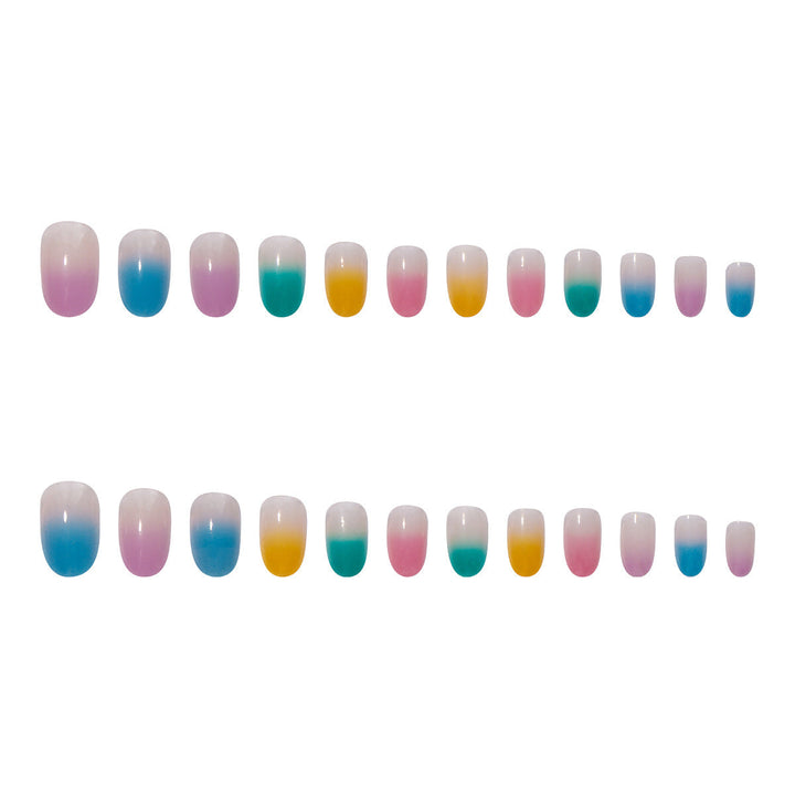 Vibrant gradient ombre press-on nails for women. Durable artificial nails offer a fashionable, easy-to-apply manicure.