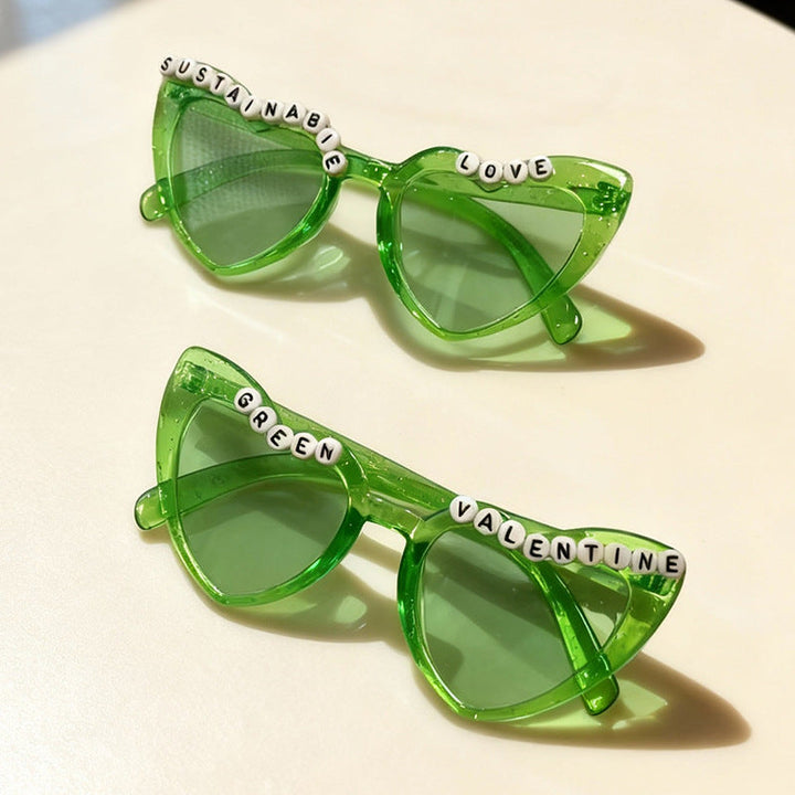 Playful cat-eye sunglasses for women in gray, with retro design and elegant beaded accents. UV protection eyewear.