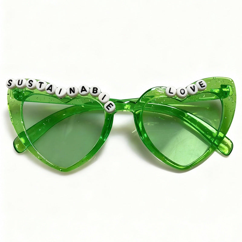 Fashion-forward women's cat-eye sunglasses. Gray retro frame with playful beaded detail for stylish UV protection.