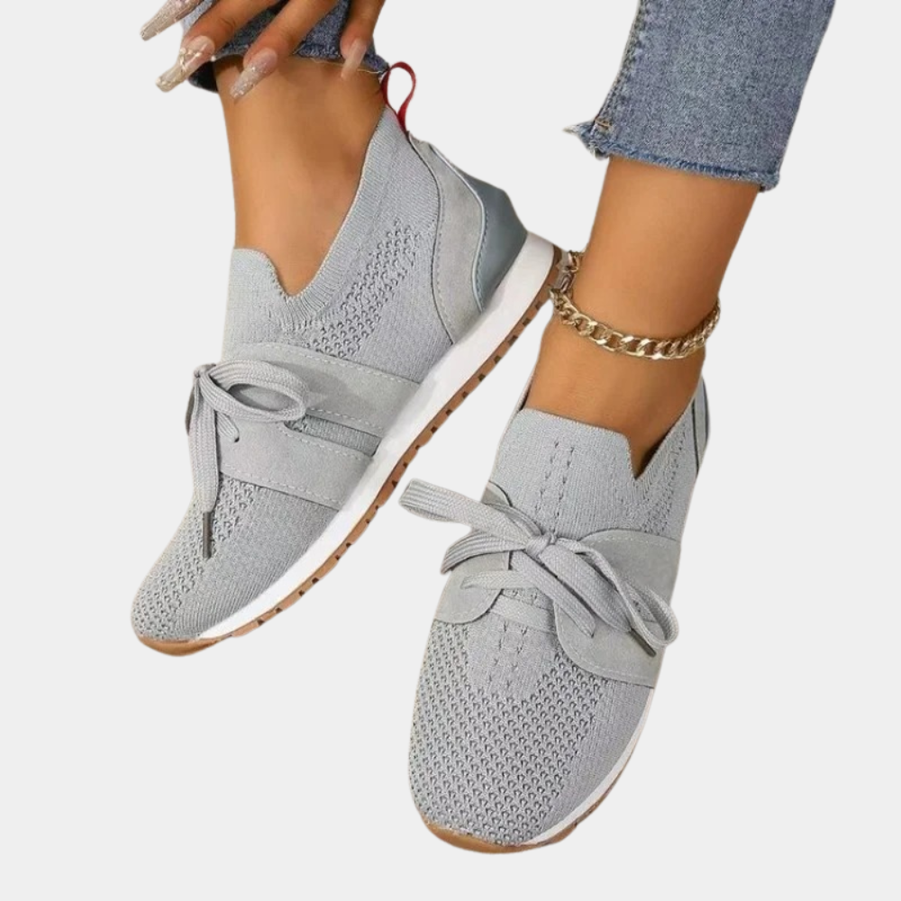 Women's grey orthopedic lace-up sneakers for comfortable everyday wear, offering support & style.
