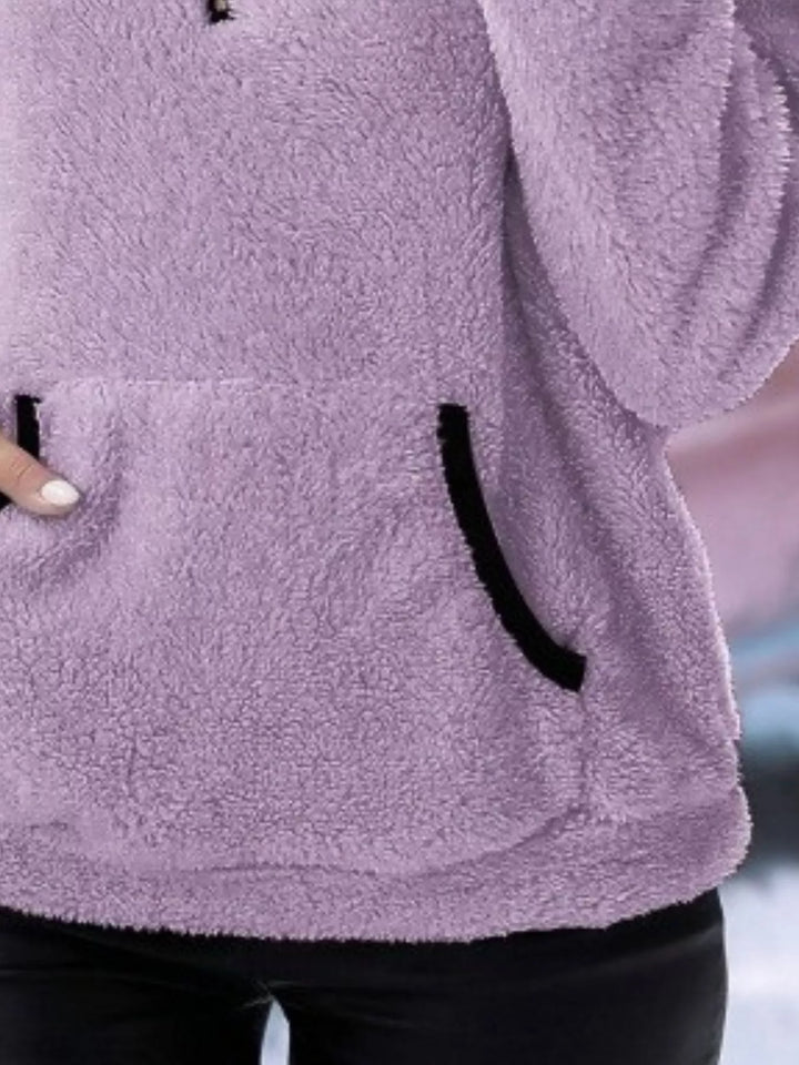 Warm women's half-zip pullover sweater, relaxed fit and comfortable with a front kangaroo pocket.