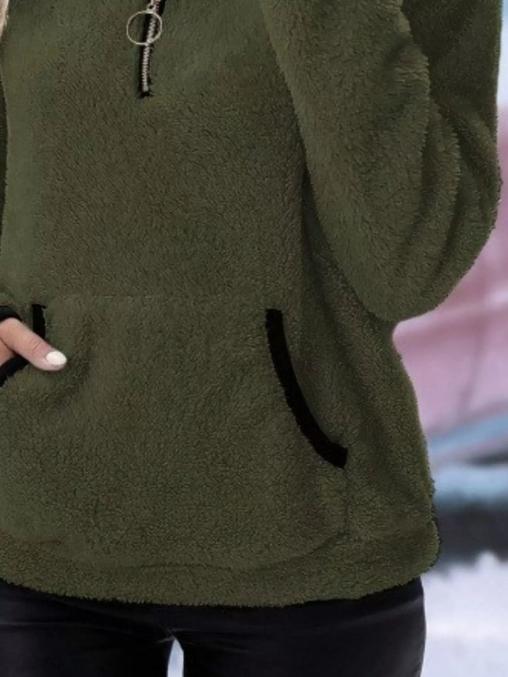 Warm women's half-zip pullover, long sleeve sweater with kangaroo pocket for ultimate comfort.